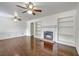 Spacious living room featuring a fireplace, built-in shelves, and hardwood floors at 302 Springview Ln # 10, Summerville, SC 29485