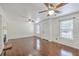Spacious living room with hardwood floors, wainscotting, and abundant natural light from large windows at 302 Springview Ln # 10, Summerville, SC 29485