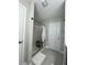 Modern bathroom featuring tiled floors, frameless glass shower, and convenient built-in bench at 315 Grouse Park, Charleston, SC 29414