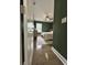 View into bedroom with green walls, hardwood floors, large window, bed, dresser, and ceiling fan at 315 Grouse Park, Charleston, SC 29414