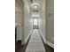 Hallway leading to bedroom with wood floor, runner, neutral wall color, and natural light at 315 Grouse Park, Charleston, SC 29414