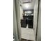 Well-lit laundry room featuring modern appliances, decorative shelving, and stylish flooring at 315 Grouse Park, Charleston, SC 29414