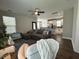 This open-concept living room boasts a large sectional sofa and a view of the kitchen at 315 Grouse Park, Charleston, SC 29414