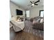 Cozy living room features a plush sectional sofa, a large TV, and a ceiling fan at 315 Grouse Park, Charleston, SC 29414