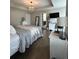 Elegant main bedroom featuring a tray ceiling, chandelier, hardwood floors, and tasteful decor at 315 Grouse Park, Charleston, SC 29414