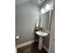 Classic powder room features a pedestal sink, decorative mirror, and stylish fixtures at 315 Grouse Park, Charleston, SC 29414