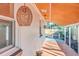 Back porch featuring a woven hanging light fixture and wood-look tile flooring at 32 Briarcliff Dr, Charleston, SC 29407