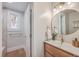 Charming bathroom with stylish vanity, gold fixtures, and ample lighting at 32 Briarcliff Dr, Charleston, SC 29407