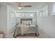 Bright bedroom with ceiling fan, and ample natural light from several windows at 32 Briarcliff Dr, Charleston, SC 29407