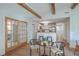 Breakfast nook with table set for four adjacent to the kitchen with exposed beams above at 32 Briarcliff Dr, Charleston, SC 29407
