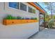 Charming home exterior featuring a lovely flower box under the window and mature landscaping at 32 Briarcliff Dr, Charleston, SC 29407