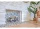 Close-up of the beautiful tile fireplace, with wooden logs at 32 Briarcliff Dr, Charleston, SC 29407