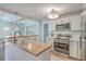 Bright kitchen with stainless steel appliances, a butcher block island, and white cabinets at 32 Briarcliff Dr, Charleston, SC 29407