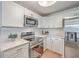 Bright kitchen featuring stainless steel appliances, quartz countertops, and white cabinets at 32 Briarcliff Dr, Charleston, SC 29407