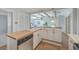 Kitchen with stainless steel dishwasher and butcher block island with room for seating at 32 Briarcliff Dr, Charleston, SC 29407