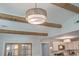 Interior ceiling with an interesting light fixture with exposed beams above the kitchen and breakfast nook at 32 Briarcliff Dr, Charleston, SC 29407