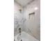 Luxurious bathtub with marble tile surround and recessed niche at 32 Briarcliff Dr, Charleston, SC 29407
