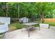 Spacious backyard featuring a patio, storage sheds, lush trees, a trampoline and a well-kept lawn at 332 Damascus Dr, Summerville, SC 29483