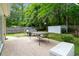 Well-maintained backyard with a patio, lush greenery, privacy fence and storage shed at 332 Damascus Dr, Summerville, SC 29483
