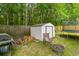 Backyard space featuring storage shed, grill, fire pit and trees; great for outdoor living at 332 Damascus Dr, Summerville, SC 29483