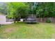 Expansive backyard featuring a trampoline, storage shed, basketball hoop, and verdant greenery at 332 Damascus Dr, Summerville, SC 29483