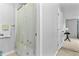 A full bathroom with a shower/tub combo, and a view into the bedroom with a table and lamp at 332 Damascus Dr, Summerville, SC 29483
