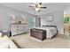 This bedroom features neutral walls, a ceiling fan, a dresser, a dark wooden chest, and carpet at 332 Damascus Dr, Summerville, SC 29483
