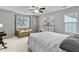 Bright bedroom featuring gray walls, carpet, sitting area, and a large window letting in natural light at 332 Damascus Dr, Summerville, SC 29483