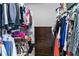 A closet with clothes hanging on racks and a chest of drawers in the middle at 332 Damascus Dr, Summerville, SC 29483