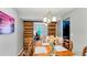 A dining room with a wooden table, chandelier, and sliding barn doors leading to another room at 332 Damascus Dr, Summerville, SC 29483