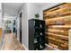 Hallway with wood-look flooring, a plant on a shoe rack, and a charming accent wall at 332 Damascus Dr, Summerville, SC 29483