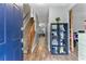 Welcoming foyer with wood-look flooring and a view of the staircase, featuring a charming shoe rack at 332 Damascus Dr, Summerville, SC 29483