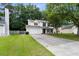 Charming two-story home featuring a well-maintained lawn, attached garage, and welcoming curb appeal at 332 Damascus Dr, Summerville, SC 29483