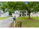 Charming two-story home showcasing a well-maintained lawn, mature trees, and inviting curb appeal at 332 Damascus Dr, Summerville, SC 29483