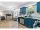 Bright kitchen with open access to the living room with inviting fireplace at 332 Damascus Dr, Summerville, SC 29483