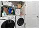 Functional laundry room with modern washer and dryer, shelving, and closet space at 332 Damascus Dr, Summerville, SC 29483