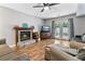 Cozy living room featuring a charming fireplace and access to the outdoors through French doors at 332 Damascus Dr, Summerville, SC 29483