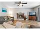Inviting living room with a cozy fireplace and plenty of comfortable seating at 332 Damascus Dr, Summerville, SC 29483