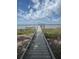 A wooden dock stretches into the water, perfect for boating and enjoying the waterfront at 3360 Baldwin Ln, Green Pond, SC 29446