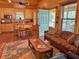 Inviting living room and kitchen with wood accents and plenty of natural light at 3360 Baldwin Ln, Green Pond, SC 29446
