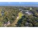An aerial view shows the landscape, with a golf course near a tree-lined property at 339 Sea Cloud Cir, Edisto Island, SC 29438