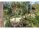 The backyard features beautiful grass, palm trees, and lush landscaping at 339 Sea Cloud Cir, Edisto Island, SC 29438