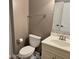 Standard bathroom featuring a toilet, vanity with sink, mirror, and towel rack at 339 Sea Cloud Cir, Edisto Island, SC 29438