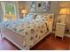Bright bedroom featuring a balcony, two side tables and hardwood flooring at 339 Sea Cloud Cir, Edisto Island, SC 29438