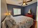 Cozy bedroom features ceiling fan, dresser, nautical decor, and window with natural light at 339 Sea Cloud Cir, Edisto Island, SC 29438