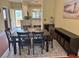Dining room with black dining set, decorative rug, coastal artwork at 339 Sea Cloud Cir, Edisto Island, SC 29438