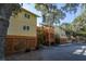 Three story buildings, light yellow with dark trim, include multiple wood balconies at 339 Sea Cloud Cir, Edisto Island, SC 29438