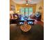Comfortable living room and dining area with sliding door access to wooden balcony and outside views at 339 Sea Cloud Cir, Edisto Island, SC 29438