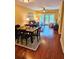 Open-concept living area featuring modern furnishings, a ceiling fan, and sliding glass doors to the balcony at 339 Sea Cloud Cir, Edisto Island, SC 29438