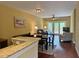 Cozy living room offering a dining area and access to the wooden balcony with nature views at 339 Sea Cloud Cir, Edisto Island, SC 29438